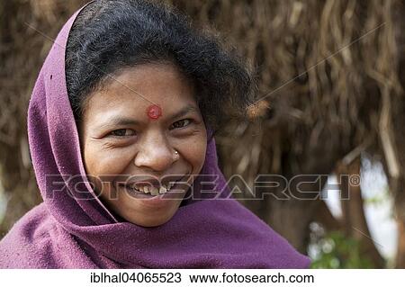 Stock Image - "Nepalese woman with purple headscarf, smiling, portrait, Bandipur, Nepal, Asia". Fotosearch