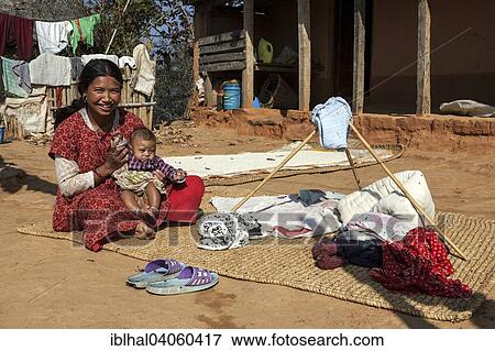 "Nepalesin with child, in the countryside, in Nargakot, Nepal, Asia" View Large Photo Image Stock Photo - "Nepalesin with child, in the countryside, in Nargakot, Nepal, Asia". Fotosearch