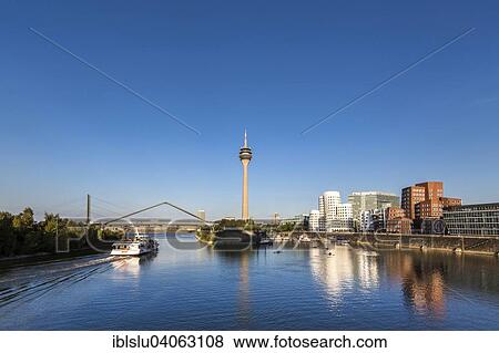 Stock Photo - "Neuer Zollhof and TV tower, Media Harbour, Dusseldorf, North Rhine-Westphalia, Germany, Europe". Fotosearch