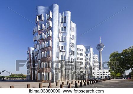 Stock Image - "Neuer Zollhof, Gehry Buildings and Rhine Tower at the Media Harbour, Dusseldorf, North Rhine-Westphalia, Germany, Europe". Fotosearch