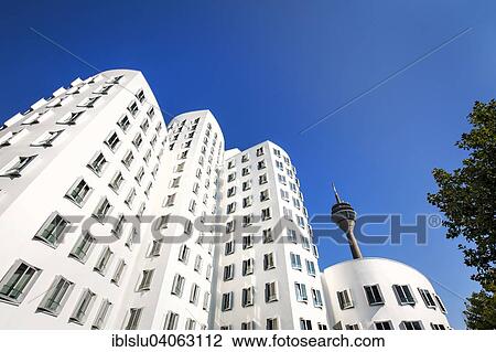 Stock Image - "Neuer Zollhof or Gehry Bauten buildings, Media Harbour, Dusseldorf, North Rhine-Westphalia, Germany, Europe". Fotosearch