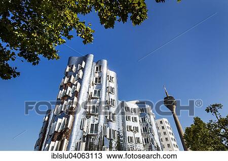 Stock Image - "Neuer Zollhof or Gehry Bauten buildings, Media Harbour, Dusseldorf, North Rhine-Westphalia, Germany, Europe". Fotosearch