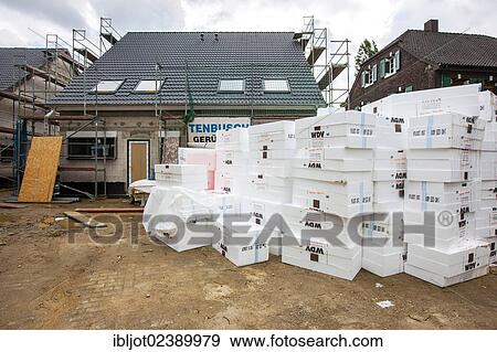 "New construction of a single-family house, a stack of insulation material lying on the construction site" View Large Photo Image Stock Photo - "New construction of a single-family house, a stack of insulation material lying on the construction site". Fotosearch