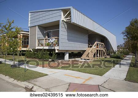 "New homes built by Brad Pitt's Make It Right Foundation, the homes are elevated to protect against future flooding and built according to green design principles, in the lower ninth ward, New Orleans, Louisiana, USA" View Large Photo Image Stock Photography - "New homes built by Brad Pitt's Make It Right Foundation, the homes are elevated to protect against future flooding and built according to green design principles, in the lower ninth ward, New Orleans, Louisiana, USA". Fotosearch