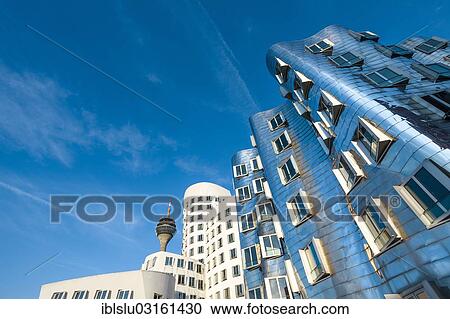 "New Zollhof office buildings designed by architect Frank O Gehry, Medienhafen, media harbour, Dusseldorf, Rhineland, North Rhine-Westphalia, Germany, Europe" View Large Photo Image Stock Image - "New Zollhof office buildings designed by architect Frank O Gehry, Medienhafen, media harbour, Dusseldorf, Rhineland, North Rhine-Westphalia, Germany, Europe". Fotosearch