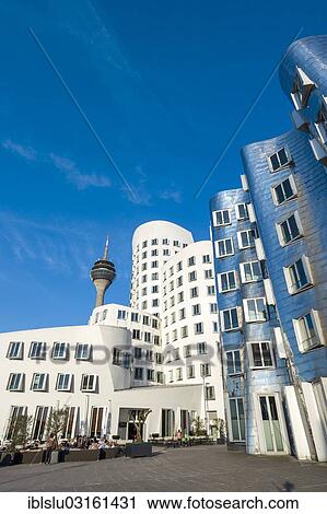 Stock Image - "New Zollhof office buildings designed by architect Frank O Gehry, Medienhafen, media harbour, Dusseldorf, Rhineland, North Rhine-Westphalia, Germany, Europe". Fotosearch