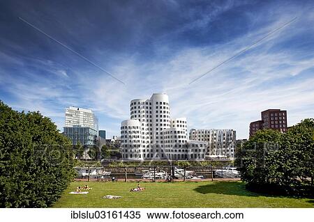 Stock Photography - "New Zollhof office buildings designed by architect Frank O Gehry, Medienhafen, media harbour, Dusseldorf, Rhineland, North Rhine-Westphalia, Germany, Europe". Fotosearch