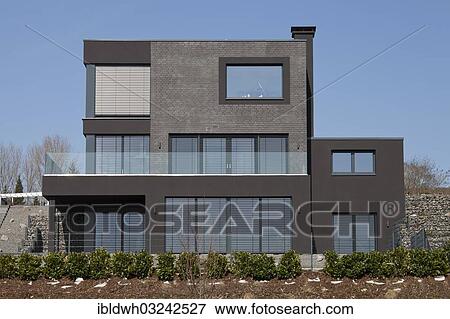 Stock Photo - "Newly built residential house with a flat roof at Phoenix-See Lake, Horde, Dortmund, Ruhr district, North Rhine-Westphalia, Germany, Europe". Fotosearch