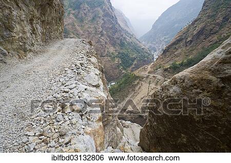 "Newly constructed road in Marsyangdi Yuni valley, dangerously leading along a steep valley, Marsyangdi Valley, Lamjung District, Annapurna Region, Nepal, Asia" View Large Photo Image Stock Photograph - "Newly constructed road in Marsyangdi Yuni valley, dangerously leading along a steep valley, Marsyangdi Valley, Lamjung District, Annapurna Region, Nepal, Asia". Fotosearch