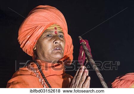 "Newly initiated Shiva sadhvi, holy woman, from Avan Akhara, praying at night at the Sangam, the confluence of the rivers Ganges, Yamuna and Saraswati, during Kumbha Mela festival, Allahabad, Uttar Pradesh, India, Asia" View Large Photo Image Stock Photo - "Newly initiated Shiva sadhvi, holy woman, from Avan Akhara, praying at night at the Sangam, the confluence of the rivers Ganges, Yamuna and Saraswati, during Kumbha Mela festival, Allahabad, Uttar Pradesh, India, Asia". Fotosearch