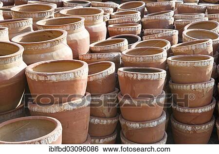 Stock Photograph - "Newly made pottery drying in the sun, Madhyapur Thimi, Kathmandu District, Bagmati Zone, Nepal, Asia". Fotosearch