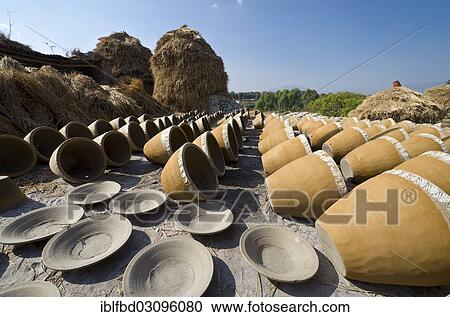 "Newly made pottery is drying in the sun, Kathmandu Valley, Thimi, Kathmandu District, Bagmati Zone, Nepal, Asia" View Large Photo Image Stock Image - "Newly made pottery is drying in the sun, Kathmandu Valley, Thimi, Kathmandu District, Bagmati Zone, Nepal, Asia". Fotosearch