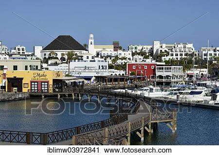 Stock Image - "Newly remodeled waterfront, restaurants, Marina Rubicon, Playa Blanca, Lanzarote, Canary Islands, Spain, Europe". Fotosearch
