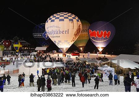 Stock Image - "Night glow at the Montgolfiade balloon event in Tegernsee, Upper Bavaria, Bavaria, Germany, Europe". Fotosearch