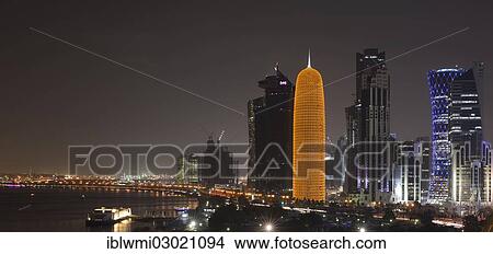 "Night scene, Corniche waterfront promenade and skyline of Doha with Al Bidda Tower, World Trade Center, Palm Tower 1 and 2, Burj Qatar Tower with golden illumination, Tornado Tower, Doha Corniche, Doha, Doha, Qatar, Asia" View Large Photo Image Picture - "Night scene, Corniche waterfront promenade and skyline of Doha with Al Bidda Tower, World Trade Center, Palm Tower 1 and 2, Burj Qatar Tower with golden illumination, Tornado Tower, Doha Corniche, Doha, Doha, Qatar, Asia". Fotosearch