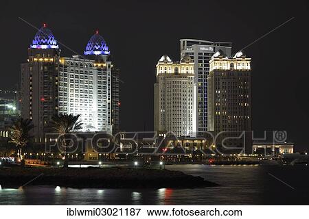 "Night scene, Four Seasons Hotel, Falcon and Pearl Towers, Doha Hilton Hotel, Doha, Doha, Qatar, Asia" View Large Photo Image Stock Photo - "Night scene, Four Seasons Hotel, Falcon and Pearl Towers, Doha Hilton Hotel, Doha, Doha, Qatar, Asia". Fotosearch