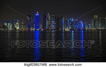 "Night scene of the skyline of Doha with Al Bidda Tower, World Trade Center, Palm Tower 1 and 2, Burj Qatar Tower, Doha Corniche, Doha, Qatar, Asia" View Large Photo Image Stock Photograph - "Night scene of the skyline of Doha with Al Bidda Tower, World Trade Center, Palm Tower 1 and 2, Burj Qatar Tower, Doha Corniche, Doha, Qatar, Asia". Fotosearch