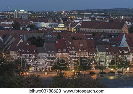 Stock Image - "Night scene, old houses on the Domplatz cathedral square and Predigerkirche church, old town, Erfurt, Thuringia, Germany, Europe". Fotosearch