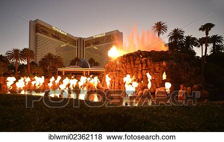 "Night scene, show, artificial volcanic eruption in front of The Mirage, luxury hotel and casino, Las Vegas, Nevada, United States of America, USA, PublicGround" View Large Photo Image Stock Photo - "Night scene, show, artificial volcanic eruption in front of The Mirage, luxury hotel and casino, Las Vegas, Nevada, United States of America, USA, PublicGround". Fotosearch