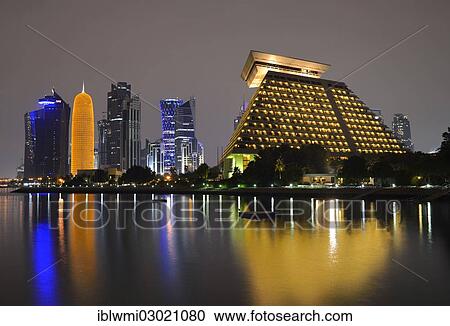 "Night scene, skyline of Doha with Al Bidda Tower, World Trade Center, Palm Tower 1 and 2, Burj Qatar Tower with golden illumination, Tornado Tower, Doha Sheraton Hotel, Doha Corniche, Doha, Doha, Qatar, Asia" View Large Photo Image Stock Image - "Night scene, skyline of Doha with Al Bidda Tower, World Trade Center, Palm Tower 1 and 2, Burj Qatar Tower with golden illumination, Tornado Tower, Doha Sheraton Hotel, Doha Corniche, Doha, Doha, Qatar, Asia". Fotosearch