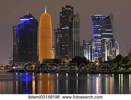 "Night scene, skyline of Doha with Al Bidda Tower, World Trade Center, Palm Tower 1 and 2, Burj Qatar Tower with golden illumination and Tornado Tower, Doha, Doha, Qatar, Asia" View Large Photo Image Stock Photograph - "Night scene, skyline of Doha with Al Bidda Tower, World Trade Center, Palm Tower 1 and 2, Burj Qatar Tower with golden illumination and Tornado Tower, Doha, Doha, Qatar, Asia". Fotosearch