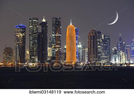 "Night skyline of Doha with the Al Bidda Tower, Palm Tower 1 and 2, World Trade Center, Burj Qatar Tower, golden illumination, Tornado Tower, crescent moon, composite, Doha, Doha, Qatar, Asia" View Large Photo Image Stock Photo - "Night skyline of Doha with the Al Bidda Tower, Palm Tower 1 and 2, World Trade Center, Burj Qatar Tower, golden illumination, Tornado Tower, crescent moon, composite, Doha, Doha, Qatar, Asia". Fotosearch