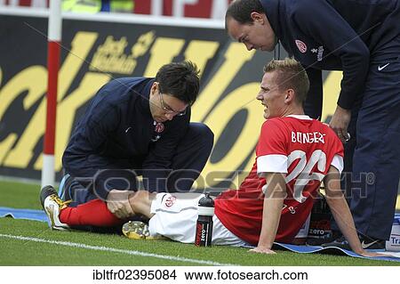 "Niko Bungert, player of FSV Mainz 05 is being treated on the sideline, FSV Mainz 05 vs Fortuna Duesseldorf, Coface-Arena, Mainz, Rhineland-Palatinate, Germany, Europe" View Large Photo Image Picture - "Niko Bungert, player of FSV Mainz 05 is being treated on the sideline, FSV Mainz 05 vs Fortuna Duesseldorf, Coface-Arena, Mainz, Rhineland-Palatinate, Germany, Europe". Fotosearch