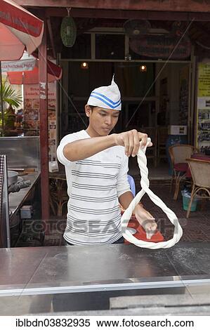 Stock Photography - "Noodle maker at a restaurant, Phnom Penh, Cambodia, Asia". Fotosearch