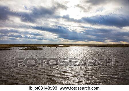 Stock Image - "North Sea and marsh landscape in winter, Spiekeroog, East Frisian Islands, East Frisia, Lower Saxony, Germany, Europe". Fotosearch
