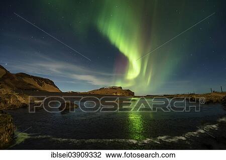 "Northern Lights over a small lake, Vik, Southern Region, Iceland, Europe" View Large Photo Image Stock Image - "Northern Lights over a small lake, Vik, Southern Region, Iceland, Europe". Fotosearch