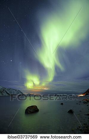 Stock Photo - "Northern Lights over fjord with winter landscape, Sommeroya, Tromso, â€ªTroms, Northern Norway, Norway, Europe". Fotosearch