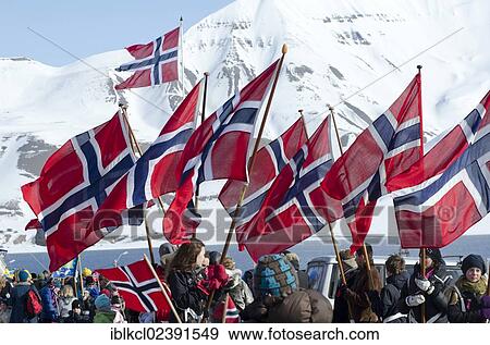 "Norwegian national flags on Norwegian National Day, 17th May, being carried through Longyearbyen, Spitsbergen, Svalbard, Norway, Europe" View Large Photo Image Stock Photo - "Norwegian national flags on Norwegian National Day, 17th May, being carried through Longyearbyen, Spitsbergen, Svalbard, Norway, Europe". Fotosearch