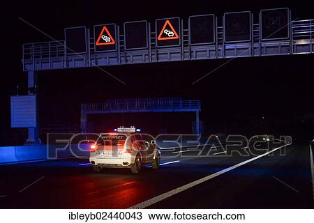 "Notarzt, German for emergency physician, driving a Porsche Cayenne towards an accident scene on the A8 motorway near the junction of Autobahnkreuz Stuttgart, Baden-Wuerttemberg, Germany, Europe" View Large Photo Image Stock Image - "Notarzt, German for emergency physician, driving a Porsche Cayenne towards an accident scene on the A8 motorway near the junction of Autobahnkreuz Stuttgart, Baden-Wuerttemberg, Germany, Europe". Fotosearch