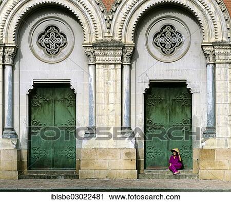 "Notre Dame, neo-Romanesque cathedral, woman with cone hat sitting at the side entrance portal, Saigon, Ho-Chi-Minh-Stadt, Sudvietnam, Vietnam, Asia" View Large Photo Image Stock Image - "Notre Dame, neo-Romanesque cathedral, woman with cone hat sitting at the side entrance portal, Saigon, Ho-Chi-Minh-Stadt, Sudvietnam, Vietnam, Asia". Fotosearch