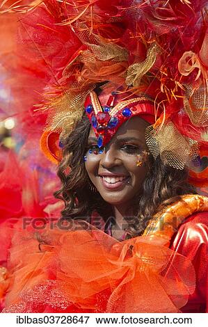 Stock Photo - "Notting Hill Carnival, costumed member of the carnival group South Connections on parade, Notting Hill, London, London region, England, United Kingdom, Europe". Fotosearch