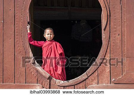 "Novice monk in the Shwe Yaunghwe Kyaung Monastery, near Nyaungshwe, Shan State, Inle Lake, Myanmar, Asia" View Large Photo Image Stock Photo - "Novice monk in the Shwe Yaunghwe Kyaung Monastery, near Nyaungshwe, Shan State, Inle Lake, Myanmar, Asia". Fotosearch