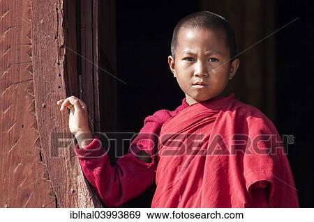 "Novice monk in the Shwe Yaunghwe Kyaung Monastery, near Nyaungshwe, Shan State, Inle Lake, Myanmar, Asia" View Large Photo Image Stock Photo - "Novice monk in the Shwe Yaunghwe Kyaung Monastery, near Nyaungshwe, Shan State, Inle Lake, Myanmar, Asia". Fotosearch