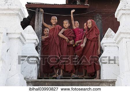 Stock Photo - "Novice monks in the Shwe Yaunghwe Kyaung Monastery, near Nyaungshwe, Shan State, Inle Lake, Myanmar, Asia". Fotosearch