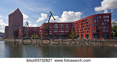 "NRW Archive building with two cranes in the inner harbour, Duisburg, Ruhr district, North Rhine-Westphalia, Germany, Europe" View Large Photo Image Stock Photo - "NRW Archive building with two cranes in the inner harbour, Duisburg, Ruhr district, North Rhine-Westphalia, Germany, Europe". Fotosearch