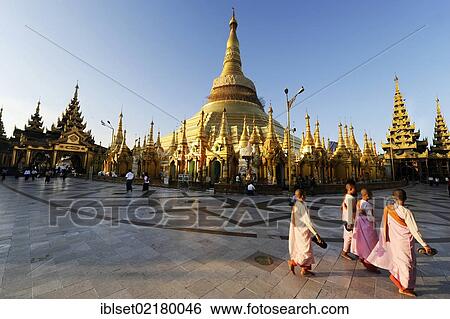 "Nuns and tourists in front of the Shwedagon Pagoda in Yangon, Myanmar, Burma, Southeast Asia, Asia" View Large Photo Image Stock Photograph - "Nuns and tourists in front of the Shwedagon Pagoda in Yangon, Myanmar, Burma, Southeast Asia, Asia". Fotosearch