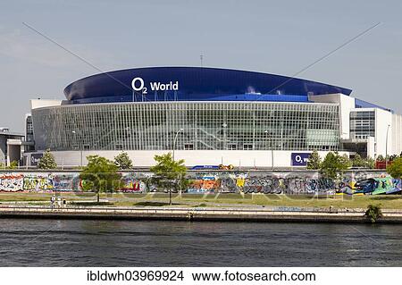 Picture - "O2 World, event venue, on the bank of the Spree river, East Side Gallery, Friedrichshain district, Berlin, Germany, Europe". Fotosearch