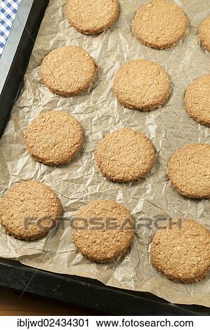Oat biscuits on baking sheet View Large Photo Image Stock Image - Oat biscuits on baking sheet. Fotosearch