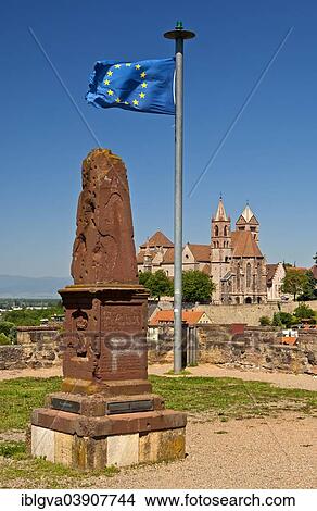 "Obelisk and the European flag on Eckartsberg hill in front of the historic centre of Breisach with St. Stephansmunster Cathedral, Breisach, Baden-Wurttemberg, Germany, Europe" View Large Photo Image Picture - "Obelisk and the European flag on Eckartsberg hill in front of the historic centre of Breisach with St. Stephansmunster Cathedral, Breisach, Baden-Wurttemberg, Germany, Europe". Fotosearch