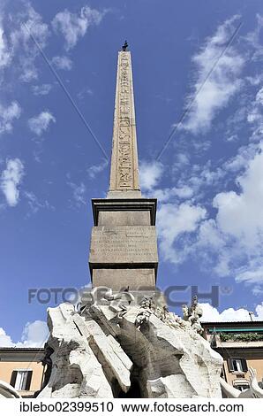 Stock Image - "Obelisk at the Fountain of the Fontana dei Quattro Fiumi, Four Rivers Fountain, also Obelisco Agonale, Piazza Navona, Rome, Lazio, Italy, Europe". Fotosearch
