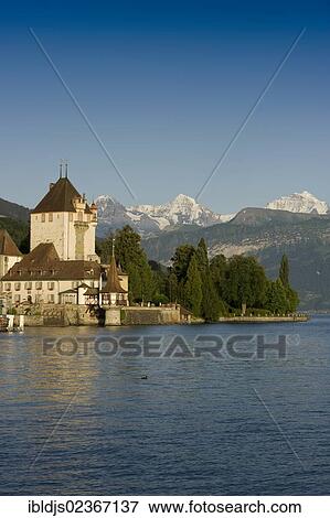 "Oberhofen Castle, in front of the Moench, Eiger and Jungfrau Mountains, Oberhofen, Lake Thun, Canton of Bern, Switzerland, Europe" View Large Photo Image Stock Photo - "Oberhofen Castle, in front of the Moench, Eiger and Jungfrau Mountains, Oberhofen, Lake Thun, Canton of Bern, Switzerland, Europe". Fotosearch