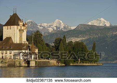 "Oberhofen Castle, in front of the Moench, Eiger and Jungfrau Mountains, Oberhofen, Lake Thun, Canton of Bern, Switzerland, Europe" View Large Photo Image Stock Photography - "Oberhofen Castle, in front of the Moench, Eiger and Jungfrau Mountains, Oberhofen, Lake Thun, Canton of Bern, Switzerland, Europe". Fotosearch