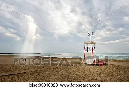 Stock Photo - "Observation tower and deck chair on the beach, atmospheric clouds, Cavallino, Jesolo, Venedig, Italy, Europe". Fotosearch
