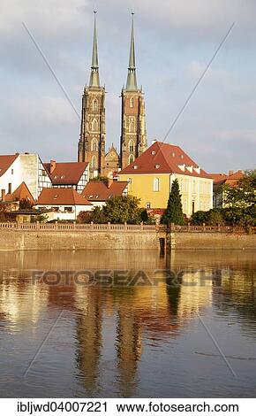 Stock Image - "Odra River with Cathedral Island Ostrow Tumski, Cathedral of St. John the Baptist and the Archbishop's residence, Wroclaw, Poland, Europe". Fotosearch