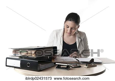 Office worker at a desk with files View Large Photo Image Stock Image - Office worker at a desk with files. Fotosearch