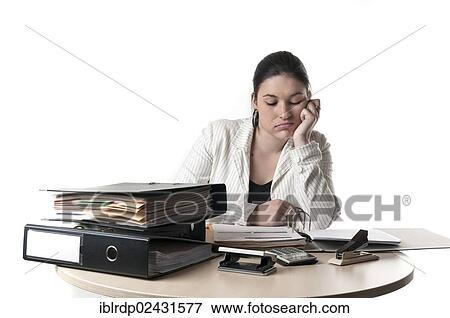 Stock Photo - Office worker at a desk with files. Fotosearch